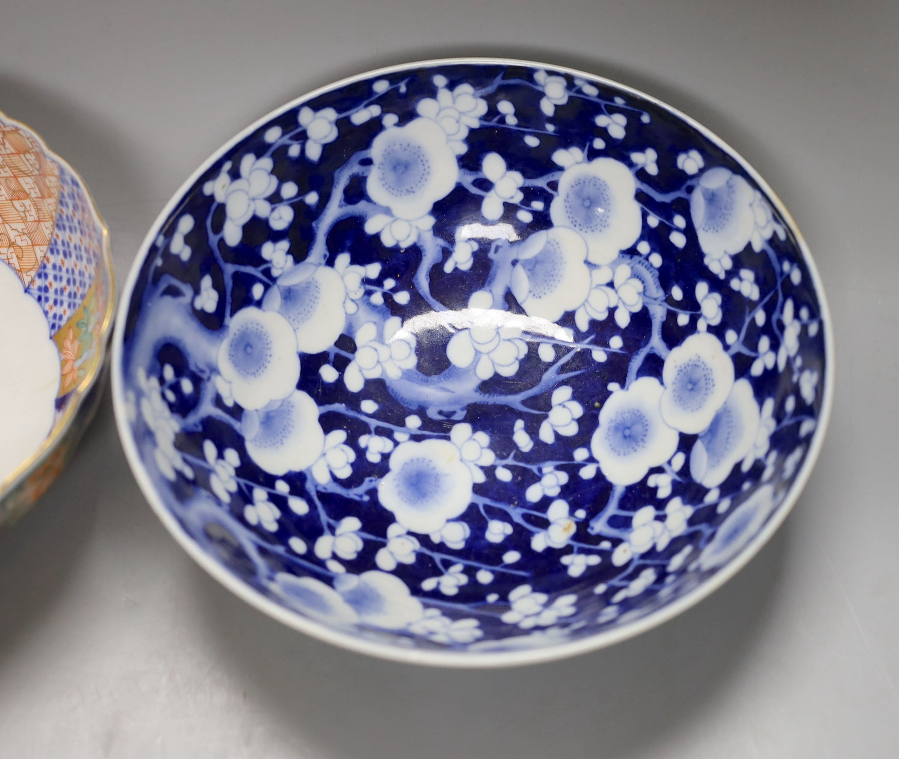 4 Chinese Qing dynasty coins, a Japanese kutani bottle vase, similar vase and cover (a.f), an Imari bowl and blue and white bowl. Largest 27cm